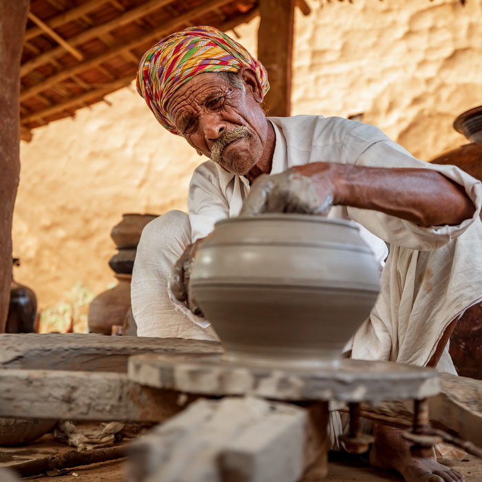 A Rajasthani potter at his wheel