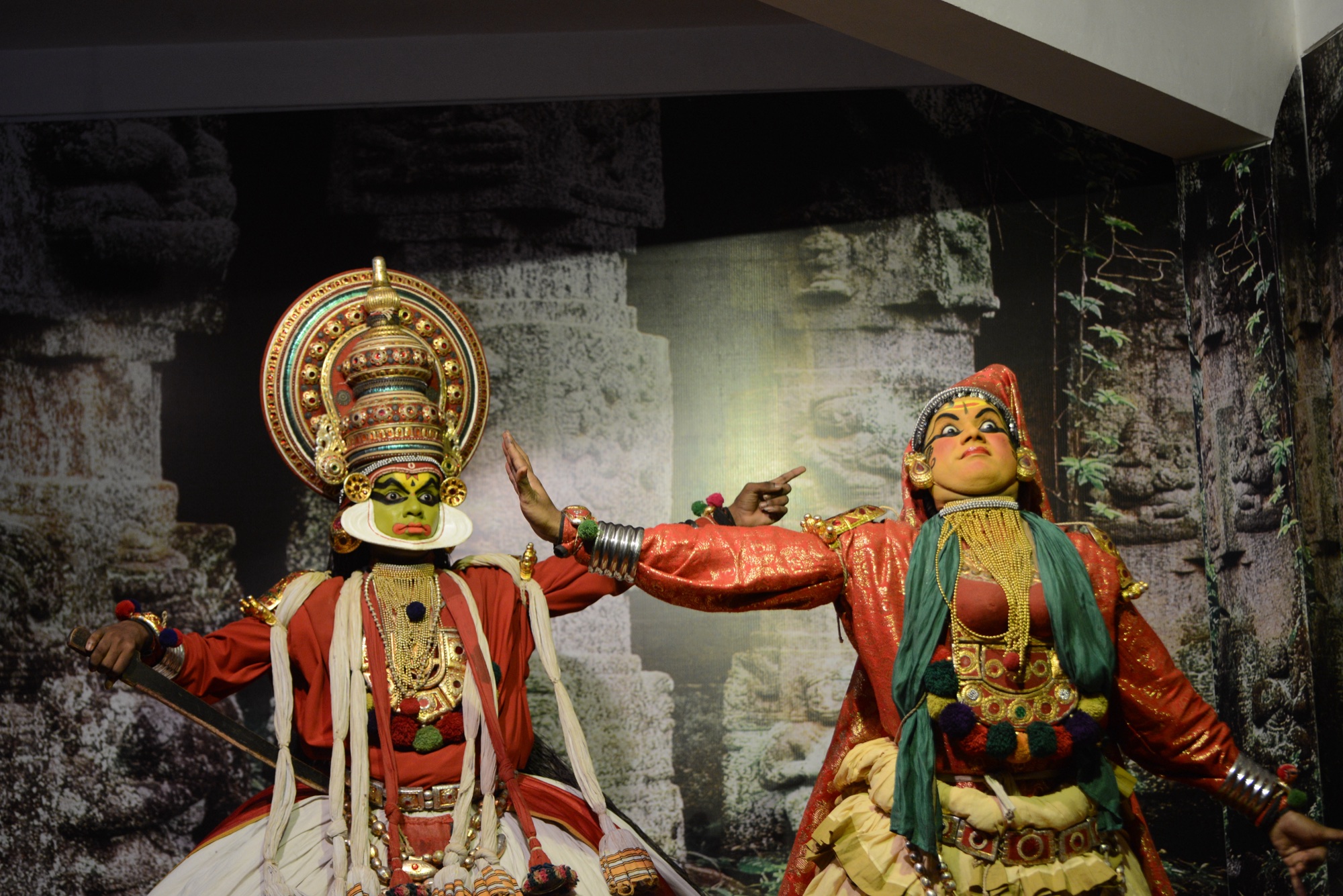 Two Kathakali performers in full costume and face paint, Kerala