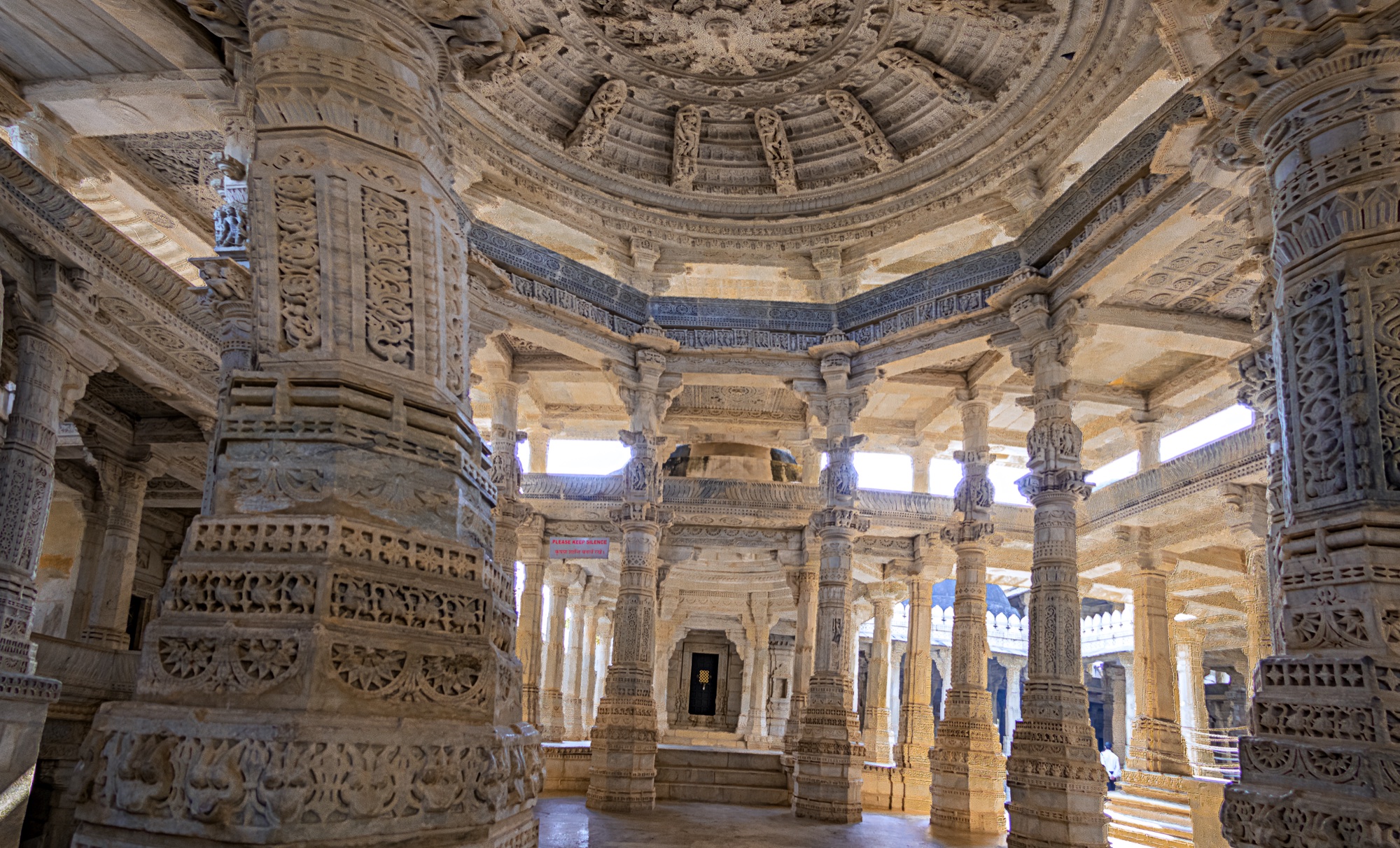 Carved marble columns and domed ceiling inside the Ranakpur Jain temple