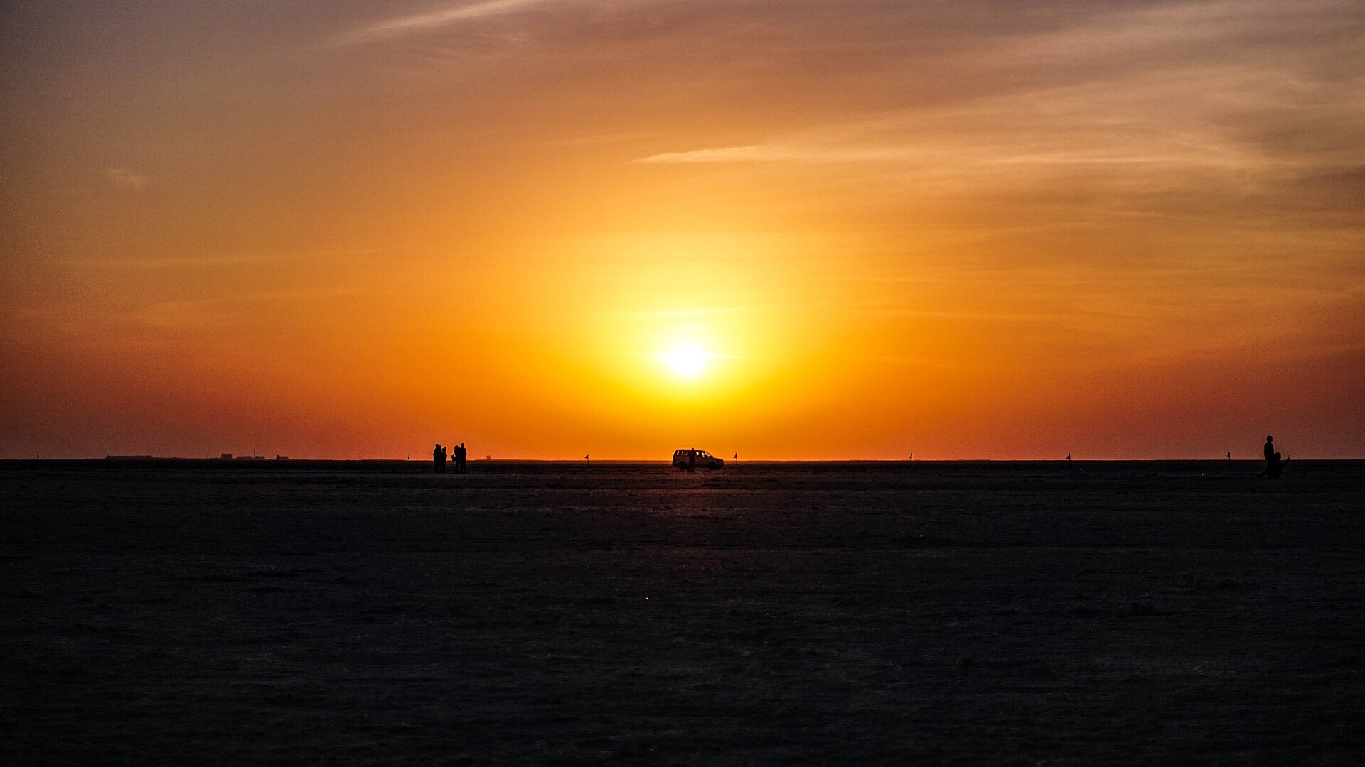Sunset over the Great Rann of Kutch at Dhordo, the flat running unbroken to the horizon