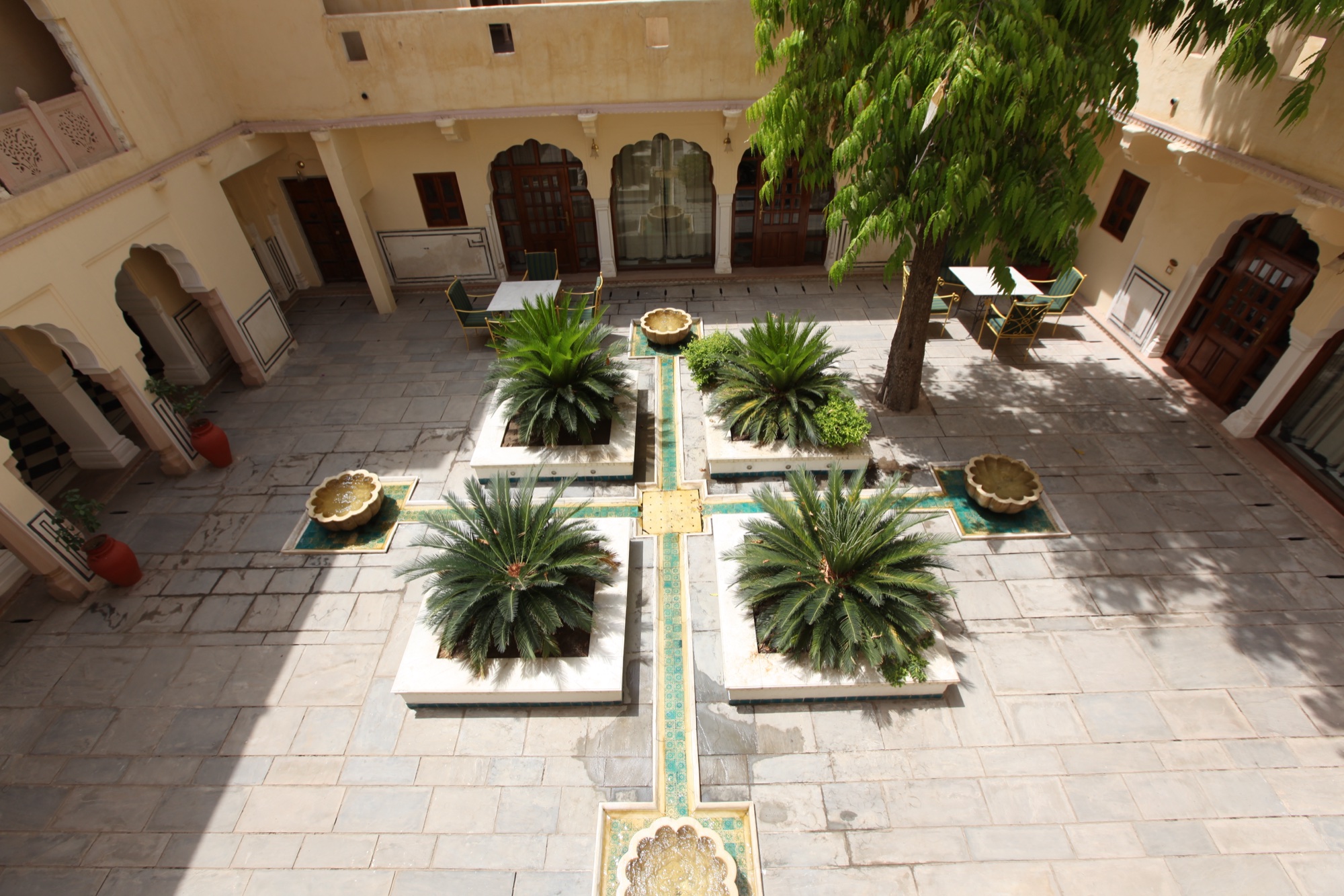 The empty courtyard of Samode Haveli, Jaipur, with its water channel