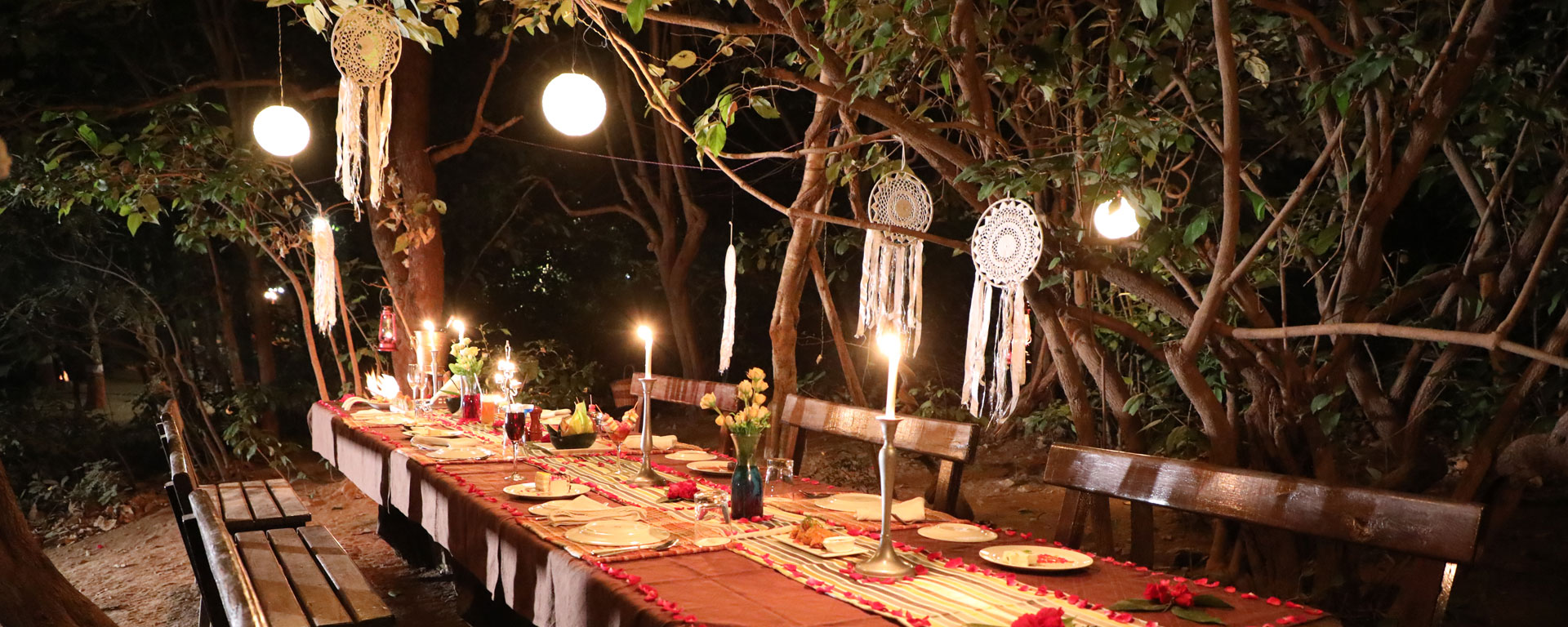 A private dining table laid by candlelight