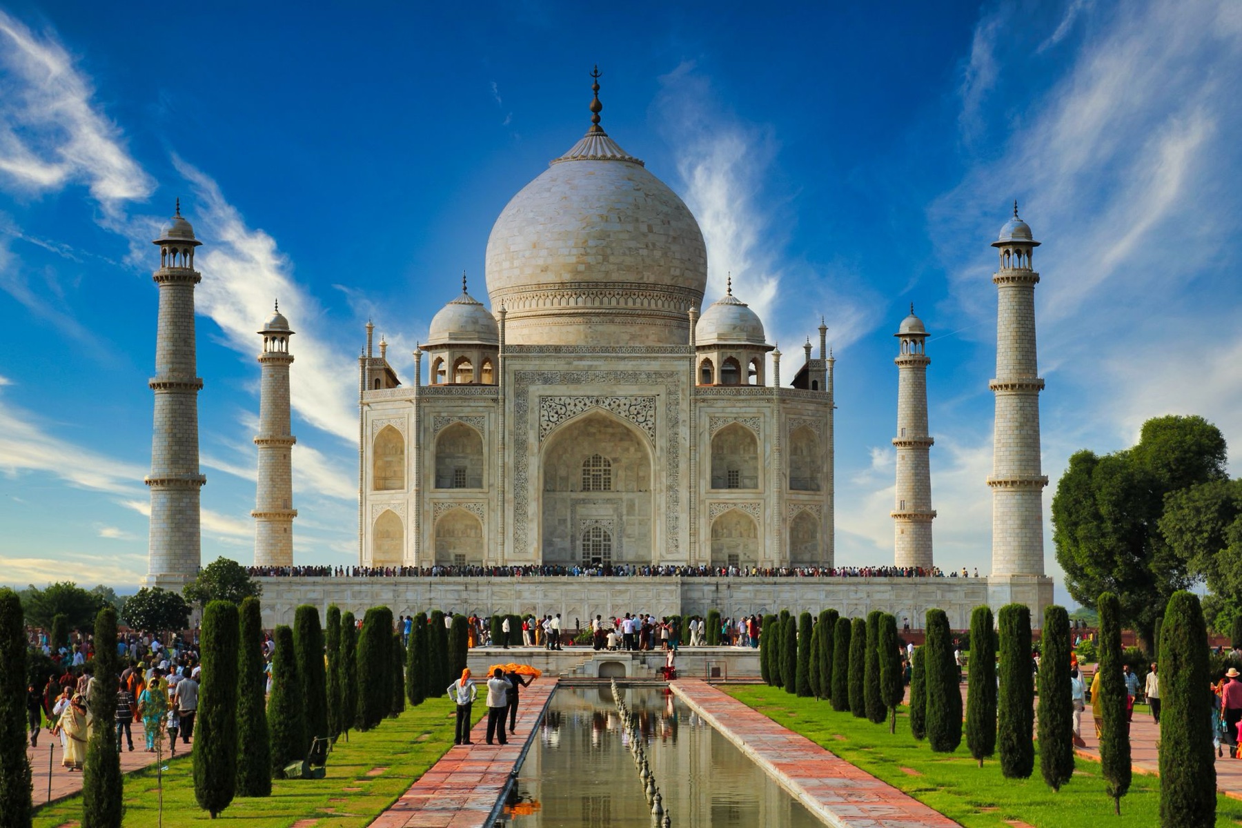 The Taj Mahal at dawn, seen across still water